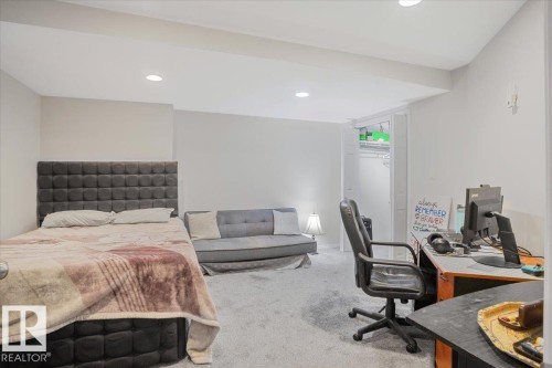 This room features light gray carpeting and recessed lighting - 3119 32 Avenue, Edmonton, AB - Indoor Photo Showing Bedroom