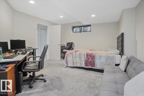 This versatile room features light-colored walls and grey carpeting, providing a neutral canvas - 3119 32 Avenue, Edmonton, AB - Indoor Photo Showing Office