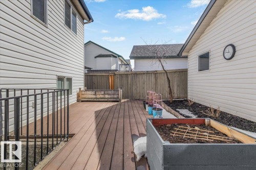 The property features a spacious wooden deck, perfect for outdoor enjoyment - 3119 32 Avenue, Edmonton, AB - Outdoor With Deck Patio Veranda With Exterior