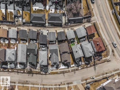 Aerial view of a residential area featuring detached properties with varying roof colors and styles - 3119 32 Avenue, Edmonton, AB - Indoor
