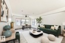 Open-concept living area featuring light wood-finish flooring, white walls, and abundant natural light from multiple windows - 301 103 Ambleside Drive, Edmonton, AB  - Indoor Photo Showing Living Room 