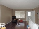 The property features rich dark wood flooring and light-toned walls - 1318 8 Avenue, Cold Lake, AB  - Indoor 
