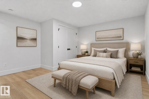 Light wood-finish flooring with white baseboards - 707 180 Street, Edmonton, AB - Indoor Photo Showing Bedroom