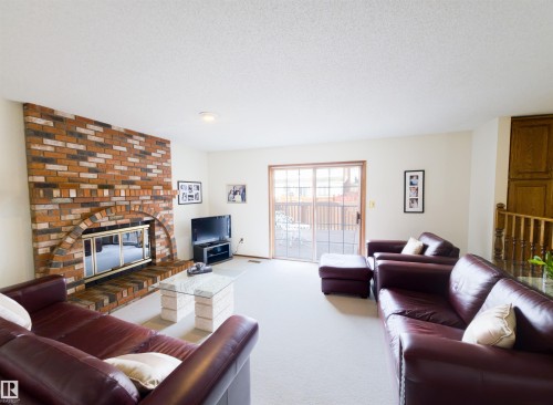 119 Castle Keep, Edmonton, AB - Indoor Photo Showing Living Room With Fireplace