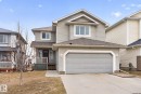 The property features a two-story design with light-colored siding and a covered front porch - 96 Dalquist Bay, Leduc, AB  - Outdoor With Facade 