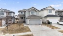 This property features a light grey exterior with white window trim and a dark roof - 96 Dalquist Bay, Leduc, AB  - Outdoor With Facade 