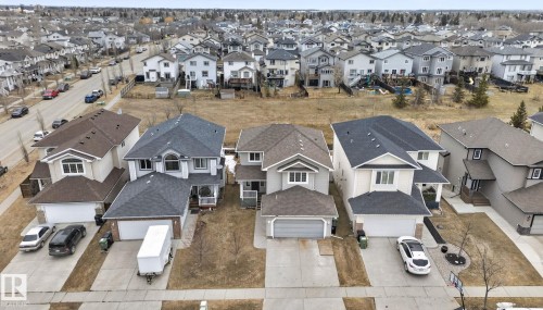 This property offers a spacious driveway and a two-car garage, providing ample parking - 96 Dalquist Bay, Leduc, AB - Outdoor With Facade