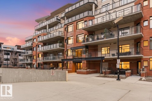 The property features a brick exterior with multiple balconies and large windows - 316 141 Festival Way, Sherwood Park, AB - Outdoor With Balcony