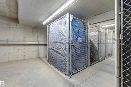 Secure storage units with chain-link fencing, concrete floors, and overhead lighting - 316 141 Festival Way, Sherwood Park, AB - 