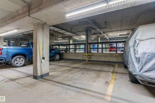 Secure underground parking space with concrete flooring and overhead lighting - 316 141 Festival Way, Sherwood Park, AB - Indoor Photo Showing Garage