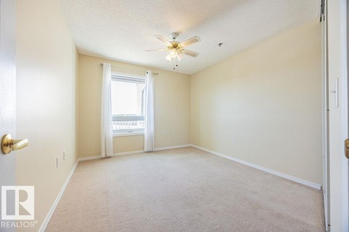 #305 9926 100 Av, Fort Saskatchewan, AB - Indoor Photo Showing Other Room
