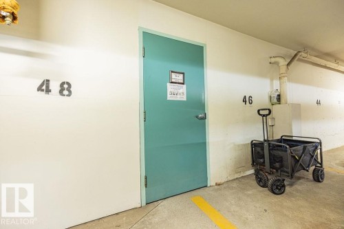 #305 9926 100 Av, Fort Saskatchewan, AB - Indoor Photo Showing Garage
