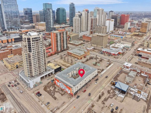 This property is located within a vibrant urban core, surrounded by a cityscape featuring a variety of high-rise buildings - 10 10331 106 Street, Edmonton, AB - Outdoor With View