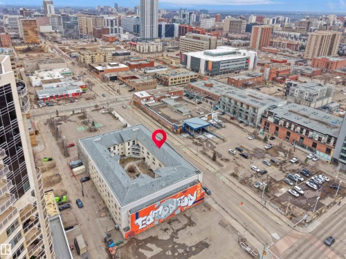 Aerial view of the property and surrounding urban area, featuring various buildings and streetscapes - 10 10331 106 Street, Edmonton, AB - Outdoor With View