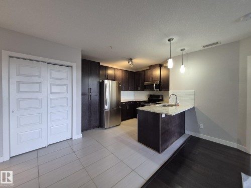 229 5151 Windermere Boulevard, Edmonton, AB - Indoor Photo Showing Kitchen