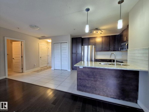 229 5151 Windermere Boulevard, Edmonton, AB - Indoor Photo Showing Kitchen With Double Sink
