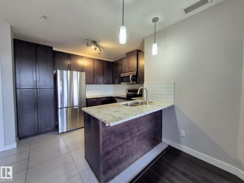 229 5151 Windermere Boulevard, Edmonton, AB - Indoor Photo Showing Kitchen With Double Sink