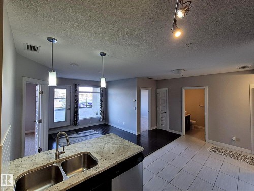 229 5151 Windermere Boulevard, Edmonton, AB - Indoor Photo Showing Kitchen With Double Sink