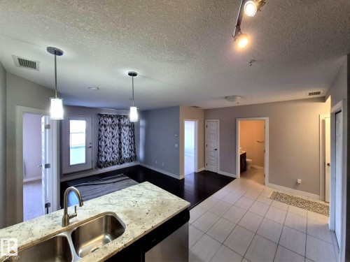 229 5151 Windermere Boulevard, Edmonton, AB - Indoor Photo Showing Kitchen With Double Sink