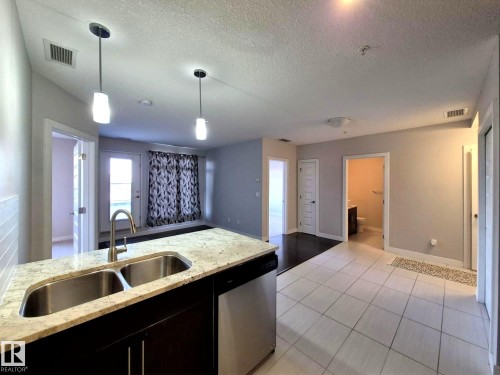229 5151 Windermere Boulevard, Edmonton, AB - Indoor Photo Showing Kitchen With Double Sink