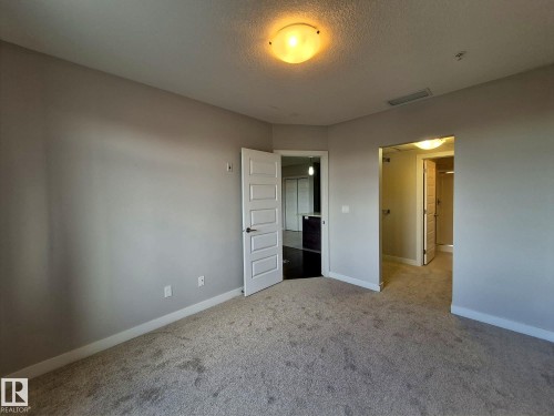 229 5151 Windermere Boulevard, Edmonton, AB - Indoor Photo Showing Other Room