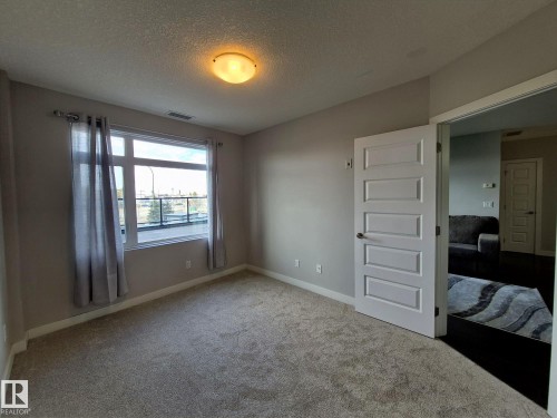 229 5151 Windermere Boulevard, Edmonton, AB - Indoor Photo Showing Other Room