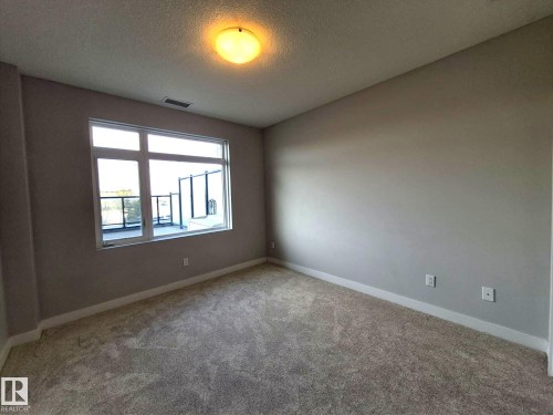 229 5151 Windermere Boulevard, Edmonton, AB - Indoor Photo Showing Other Room