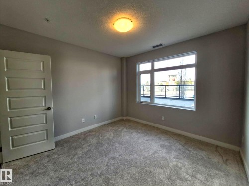229 5151 Windermere Boulevard, Edmonton, AB - Indoor Photo Showing Other Room