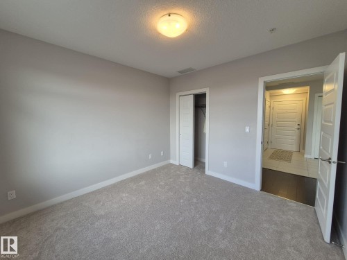 229 5151 Windermere Boulevard, Edmonton, AB - Indoor Photo Showing Other Room