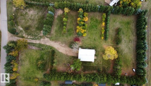 The property features a private lot with a single-story structure and a gravel driveway - Lot 118 Homestead Trail, Rural St. Paul County, AB 