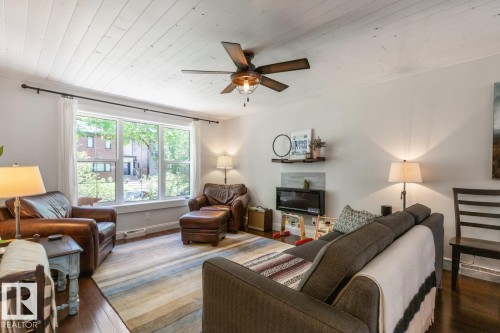 9328 94 Street, Edmonton, AB - Indoor Photo Showing Living Room With Fireplace