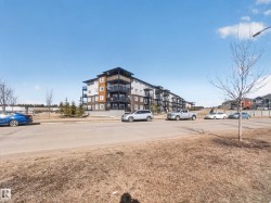 The property is a low-rise apartment building with multiple floors and balconies - 