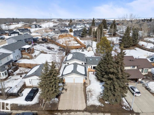 This property includes a double garage and a concrete driveway - 1929 Forest Drive, Cold Lake, AB - Outdoor With View