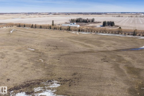 Expansive land featuring large open fields and distant structures - 9610 167 Street Sw, Edmonton, AB - Outdoor With View