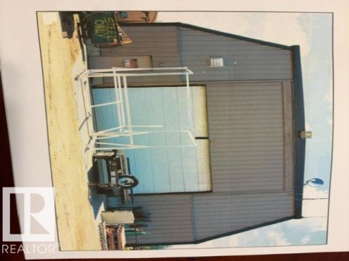 The property features an industrial-style building with corrugated metal siding - 9610 167 Street Sw, Edmonton, AB -  With Exterior