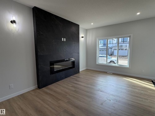 271 Munn Way, Leduc, AB - Indoor Photo Showing Living Room With Fireplace