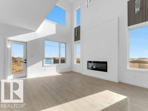 8512 Mayday Run Run, Edmonton, AB - Indoor Photo Showing Living Room With Fireplace