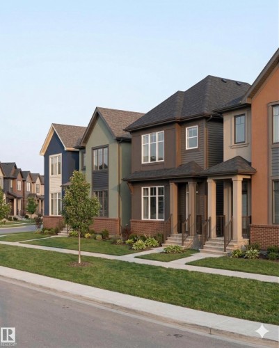 The property features a row of homes with varying exterior colors, each with a front lawn, sidewalk, and brick accents - 558 Ashgrove Circle, Leduc, AB - Outdoor With Facade