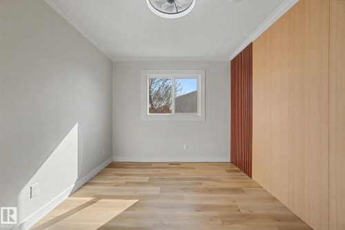 Room featuring light-toned flooring, white walls, and a window with a view of trees - 186 Centennial Crest, Edmonton, AB - Indoor Photo Showing Other Room