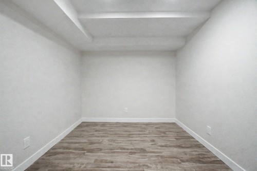 This room features light-colored flooring and white walls - 186 Centennial Crest, Edmonton, AB - Indoor Photo Showing Other Room