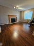 Edmonton, AB  - Indoor Photo Showing Living Room With Fireplace 