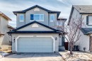 This property features light blue siding, a dark roof, and a double garage with a light blue door - 11415 167A Avenue, Edmonton, AB  - Outdoor 