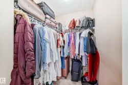 The property features a closet with wire shelving and a hanging rod, providing storage solutions - 