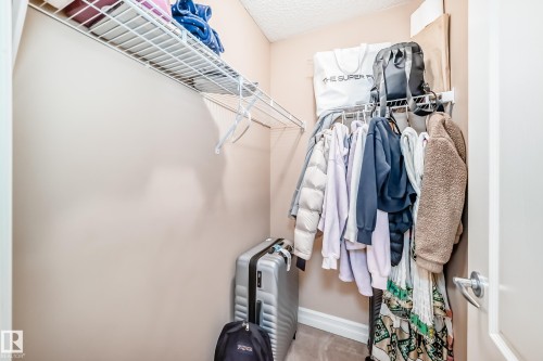 The property features a closet with a wire rack and hanging rod for storage - 11415 167A Avenue, Edmonton, AB - Indoor With Storage