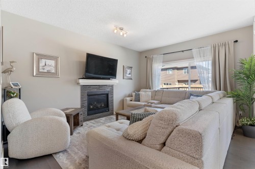 6006 19A Avenue, Edmonton, AB - Indoor Photo Showing Living Room With Fireplace