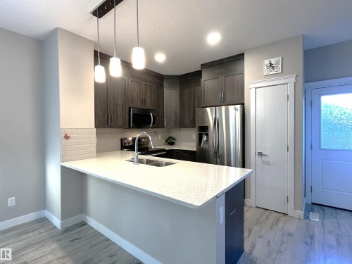 729 Berg Loop, Leduc, AB - Indoor Photo Showing Kitchen With Stainless Steel Kitchen With Double Sink With Upgraded Kitchen