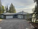 Ranch-style residence featuring light gray siding and stone facade accents - #12 61212  Rr 463, Rural Bonnyville M.D., AB  - Outdoor 