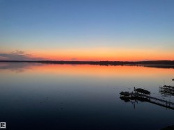 The property offers tranquil waterfront views with a dock and space for a boat - 