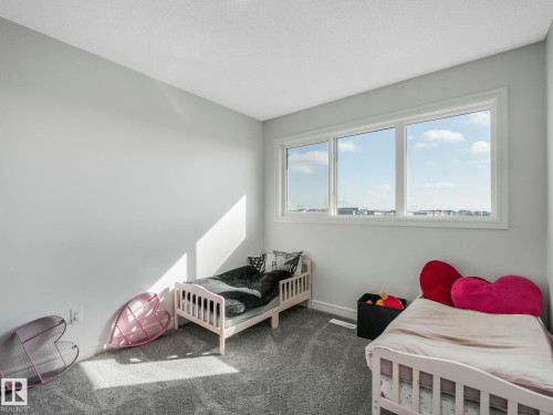 This room features light grey walls and carpeted flooring - 2636 192 Street, Edmonton, AB - Indoor Photo Showing Bedroom