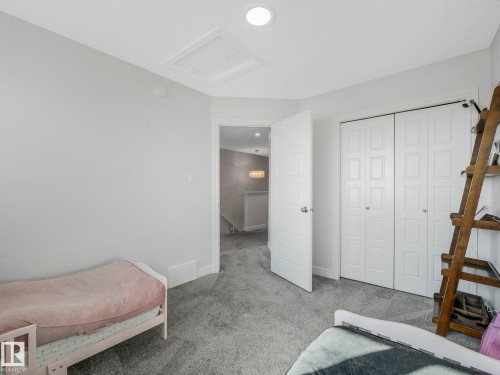 This room features light grey walls and grey carpet flooring - 2636 192 Street, Edmonton, AB - Indoor Photo Showing Bedroom
